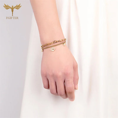 Goldenes Charm-Armband mit Augen- und Kristalldetails