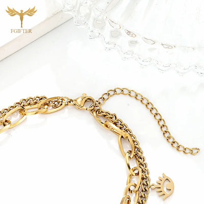 Goldenes Charm-Armband mit Augen- und Kristalldetails