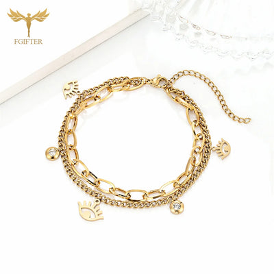 Goldenes Charm-Armband mit Augen- und Kristalldetails
