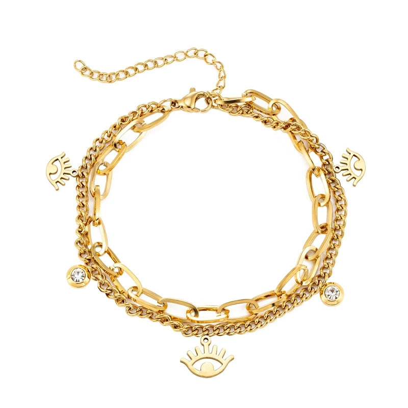 Goldenes Charm-Armband mit Augen- und Kristalldetails