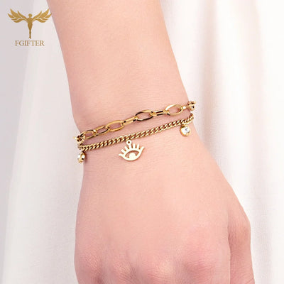 Goldenes Charm-Armband mit Augen- und Kristalldetails